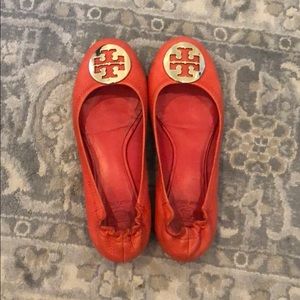 Tory Burch orange With gold emblem